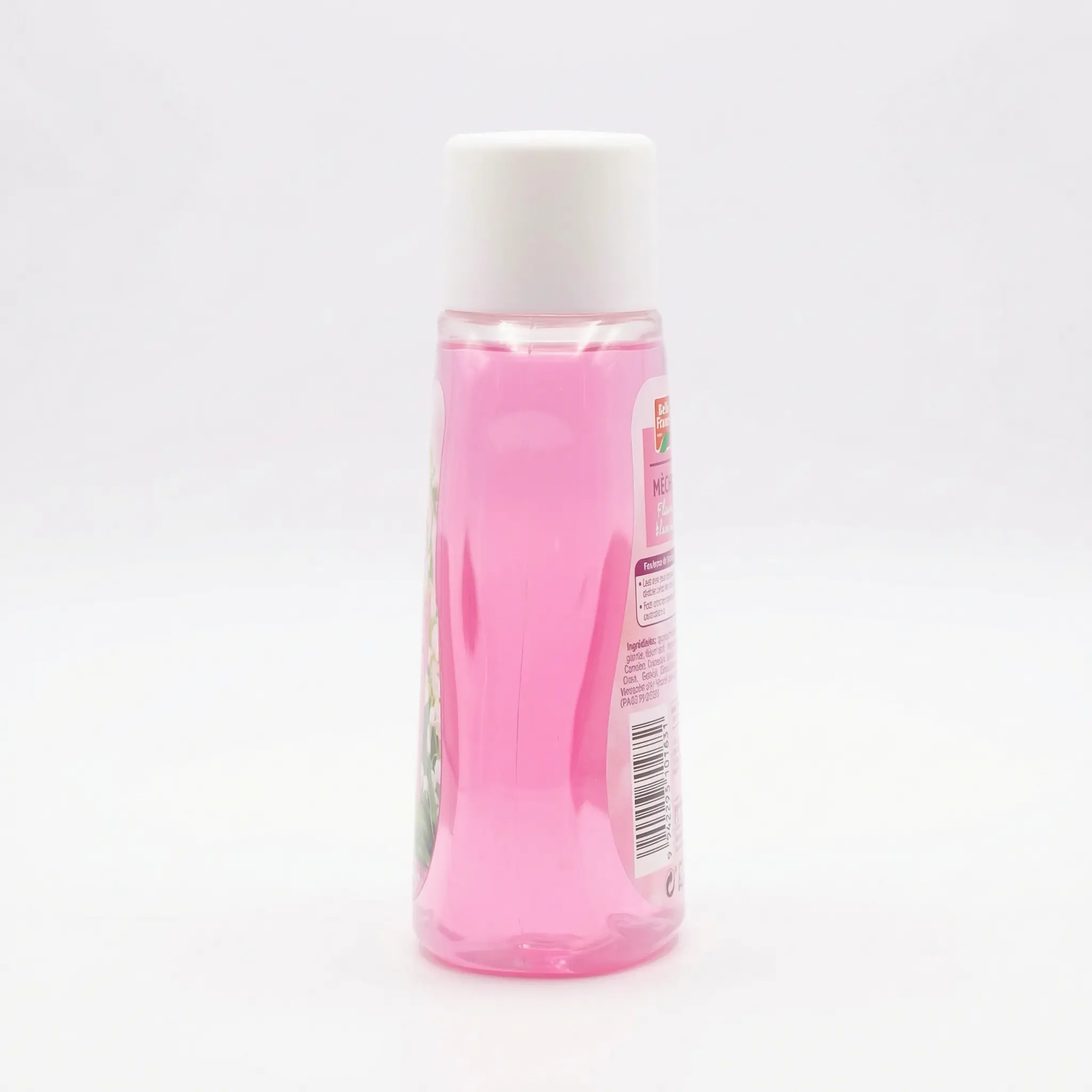 Vue latérale du flacon Fleur Blanche BF avec étiquette florale.